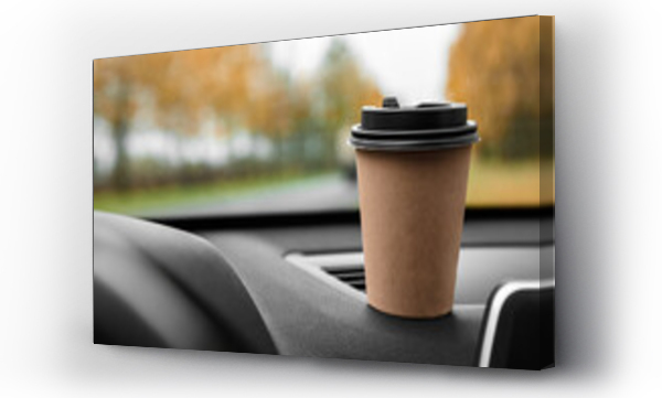 Wizualizacja Obrazu : #672262515 Paper cup with coffee on dashboard of car on autumn background.