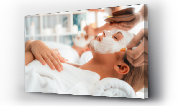Wizualizacja Obrazu : #684911848 Serene ambiance of spa salon, couple indulges in rejuvenating with luxurious face cream massage with modern daylight. Facial skin treatment and beauty care concept. Quiescent