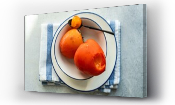 Wizualizacja Obrazu : #685229496 Overhead view of a bowl of Ripe persimmon fruit