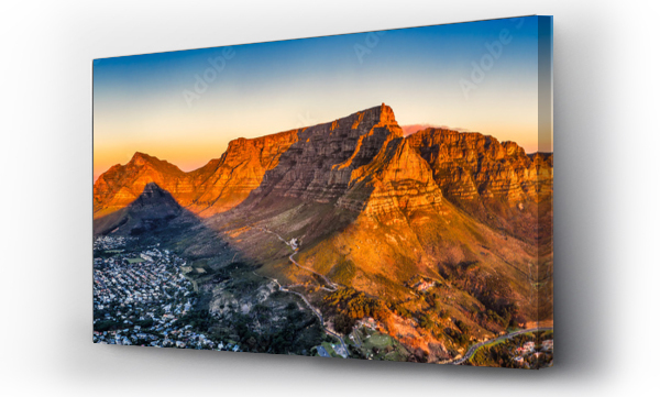 Wizualizacja Obrazu : #688133466 cape town aerial panorama from the table mountain at sunset, sun shining on the mountain range town in the dusk