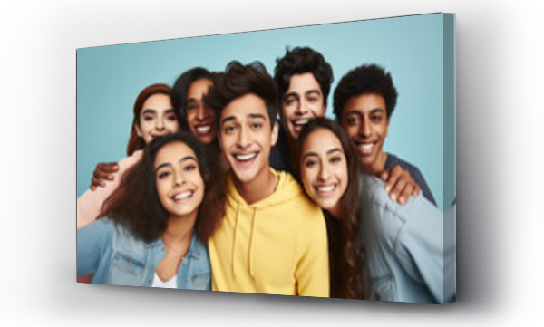 Wizualizacja Obrazu : #690877436 Banner of group of multiracial friends taking selfie picture smiling at camera. Laughing young people celebrating on blue studio background. Portrait of student guys and girls enjoying time together