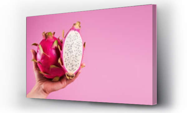 Wizualizacja Obrazu : #693612379 Hand holding sliced dragon fruit isolated on pastel background