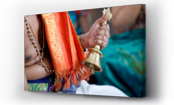 Wizualizacja Obrazu : #694891240 Hand holding ceremonial bell, Sri Srinivasa Perumal Hindu temple, Hindu priest (Brahmin) performing puja ceremony and rituals, Singapore