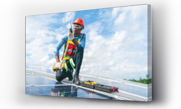 Wizualizacja Obrazu : #695397518 African American engineer maintaining solar cell panels on factory building rooftop. Technician working outdoor on ecological solar farm construction. Renewable clean energy technology concept