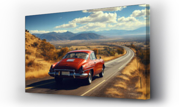 Wizualizacja Obrazu : #698927196 Vintage red sports car rides an empty mountain highway on a sunny day, rear view