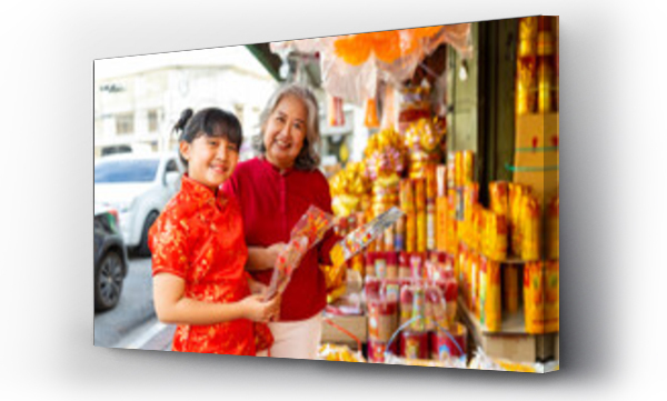 Wizualizacja Obrazu : #699052207 Chinese lunar new year festival and tradition holiday celebration concept. Asian grandmother and grandchild girl buying home decorative ornaments for celebrating Chinese New Year at Chinatown market.