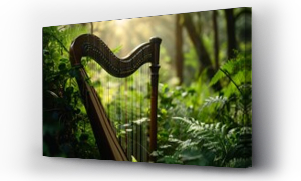 Wizualizacja Obrazu : #702957520   Beautiful Celtic harp stands in the middle of a green enchanted forest with sun rays shining through the trees. Symbol of Ireland, Irish traditional music, St Patricks Day. Copy space for text 