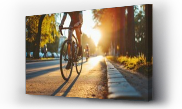 Wizualizacja Obrazu : #703579773 Cyclist riding bike sports outdoors on sunny day.