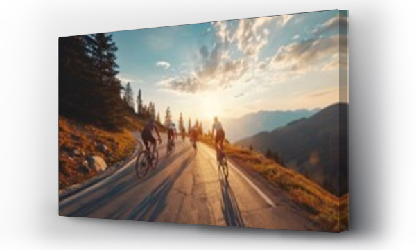 Wizualizacja Obrazu : #703579836 Cyclists team rides on mountain road at sunset sky.
