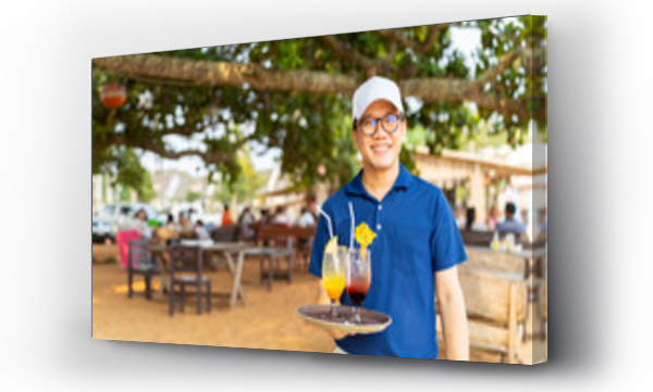 Wizualizacja Obrazu : #727712655 Portrait of Asian man waiter serving food and drink to customer on the table at tropical beach cafe and restaurant on summer holiday vacation. Food and drink business service occupation concept.