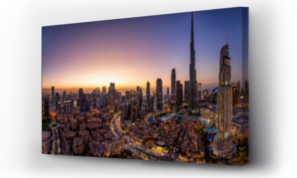 Wizualizacja Obrazu : #743024705 Panoramic view of the illuminated Downtown district skyline of Dubai, UAE, with the modern Skyscrapers and traditional buidings during dusk