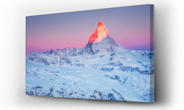 Wizualizacja Obrazu : #748015826 First sunrays on the snowy peak of Matterhorn mountain  with pink sky at sunrise in the Swiss Alps