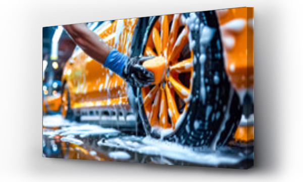 Wizualizacja Obrazu : #754896117 Car wash with foam soap. Close-up of a workers hand with protective gloves washing a yellow car alloy wheel with a sponge. Car Wash Banner with Copy Space