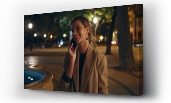Wizualizacja Obrazu : #764021270 Attractive woman speaking mobile phone on city square. Smiling girl enjoying