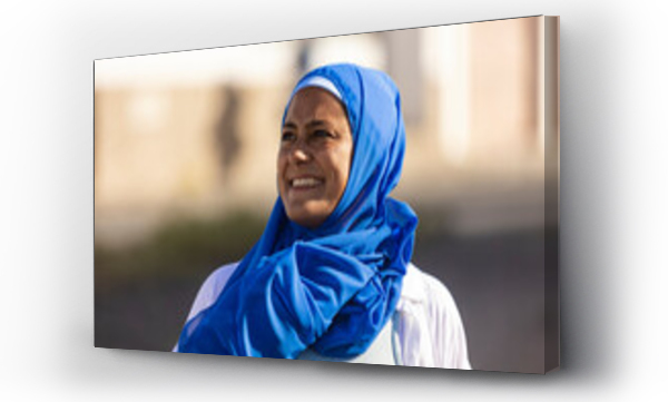 Wizualizacja Obrazu : #767035289 Joyful woman in blue hijab outdoors