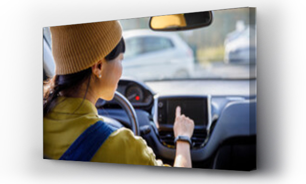 Wizualizacja Obrazu : #770964258 Woman using GPS navigator while driving car in city