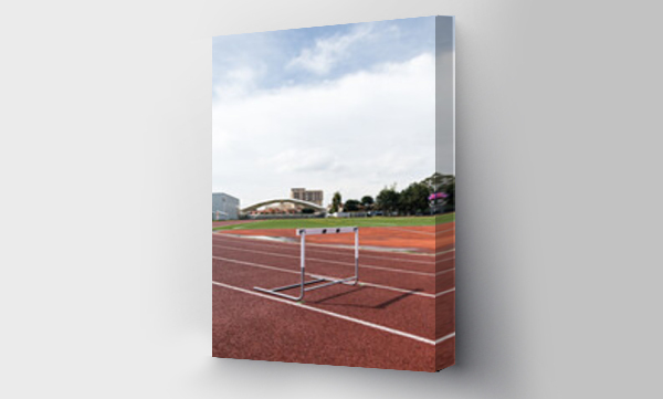 Wizualizacja Obrazu : #777683481 An athletic hurdle placed in the middle of a running track