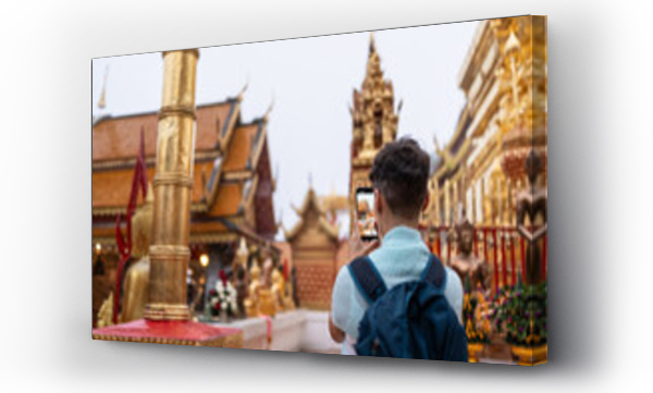Wizualizacja Obrazu : #777887502 Tourist with mobile phone at a temple.
